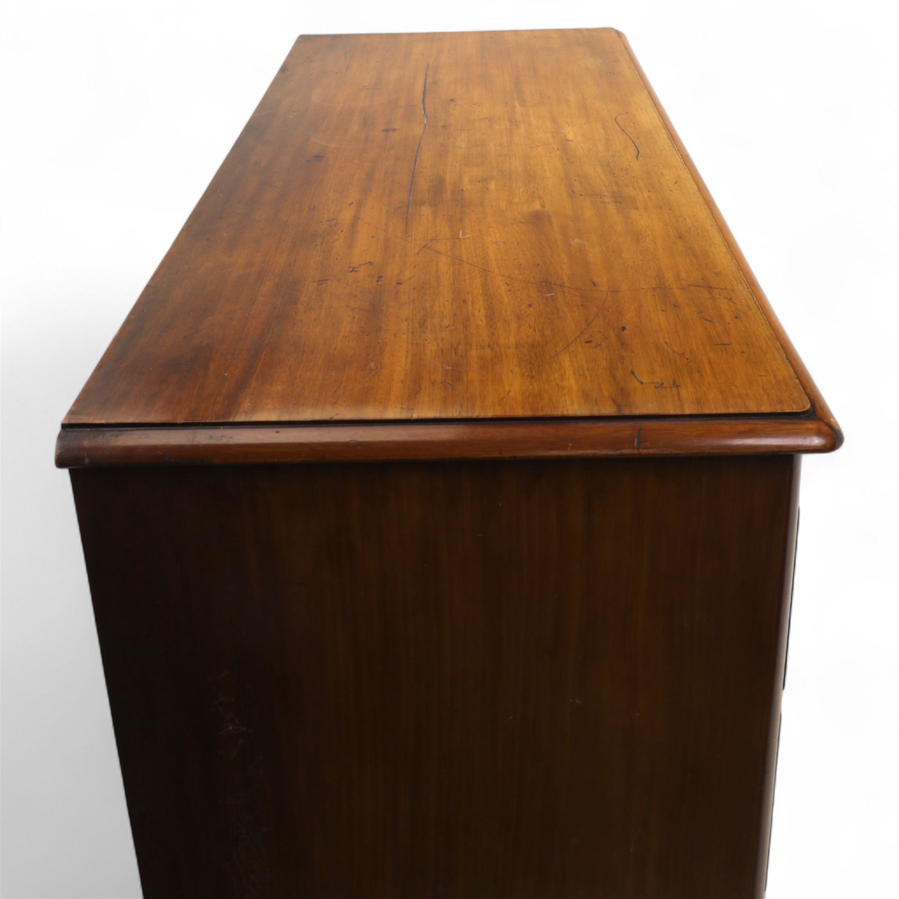Victorian flamed mahogany chest, fitted with two short and three long drawers, turned wooden handles, raised on bun feet