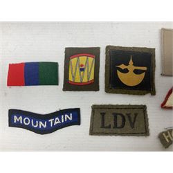 Royal Arms cloth arm adge as worn by Regimental Serjeant-Majors in Foot Guards; naval cap badge; WW2 Commando/Special Forces cloth badges; Home Guard and LDV shoulder titles; and other cloth badges including armoured division, 45th and 77th division, 52nd Lowland Mountain division etc; and 24th Infantry Brigade airmobile pennant