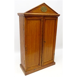  Early 20th century 'Army & Navy' oak wall mounted rectangular tool cabinet with arched pediment with early 20th century and later tools, H66cm x W38cm   