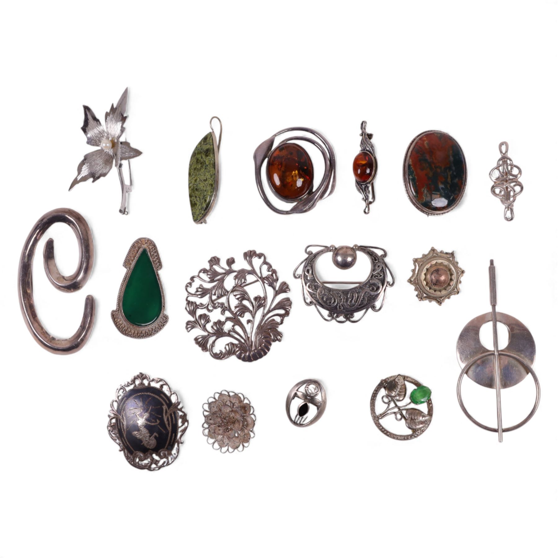 Silver brooches, including Baltic amber, moss agate and modernist examples, together with a large collection of costume brooches