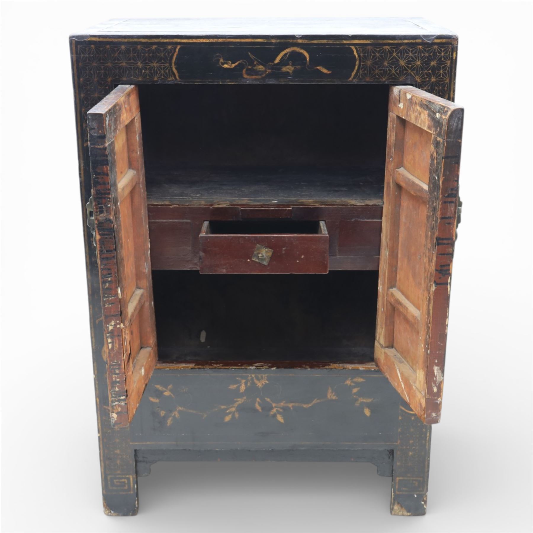 19th century Chinese black lacquer marriage cabinet, rectangular form, twin cupboard doors painted with gilt chinoiserie scenes depicting mounted figures, ritual urns and symbolic objects within patterned borders, central shaped metal lock plate with twin drop handles, lower section decorated with fruiting sprays, standing on stile supports