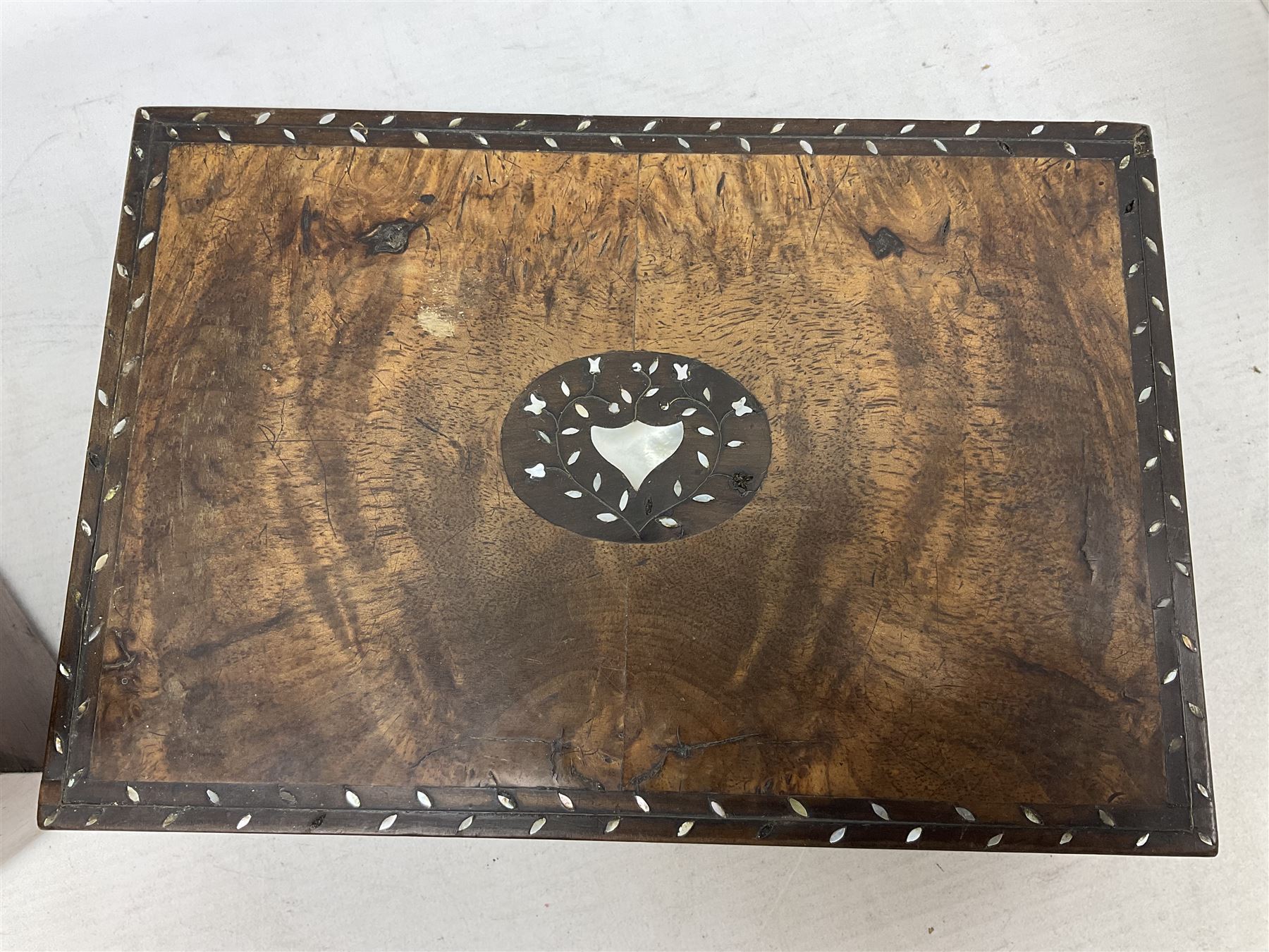 Walnut tea caddy of sarcophagus form, two division lidded interior with a later glass mixing bowl, upon four brass bun feet together with a walnut sewing box with mother of pearl inlaid decoration, tea caddy H16cm