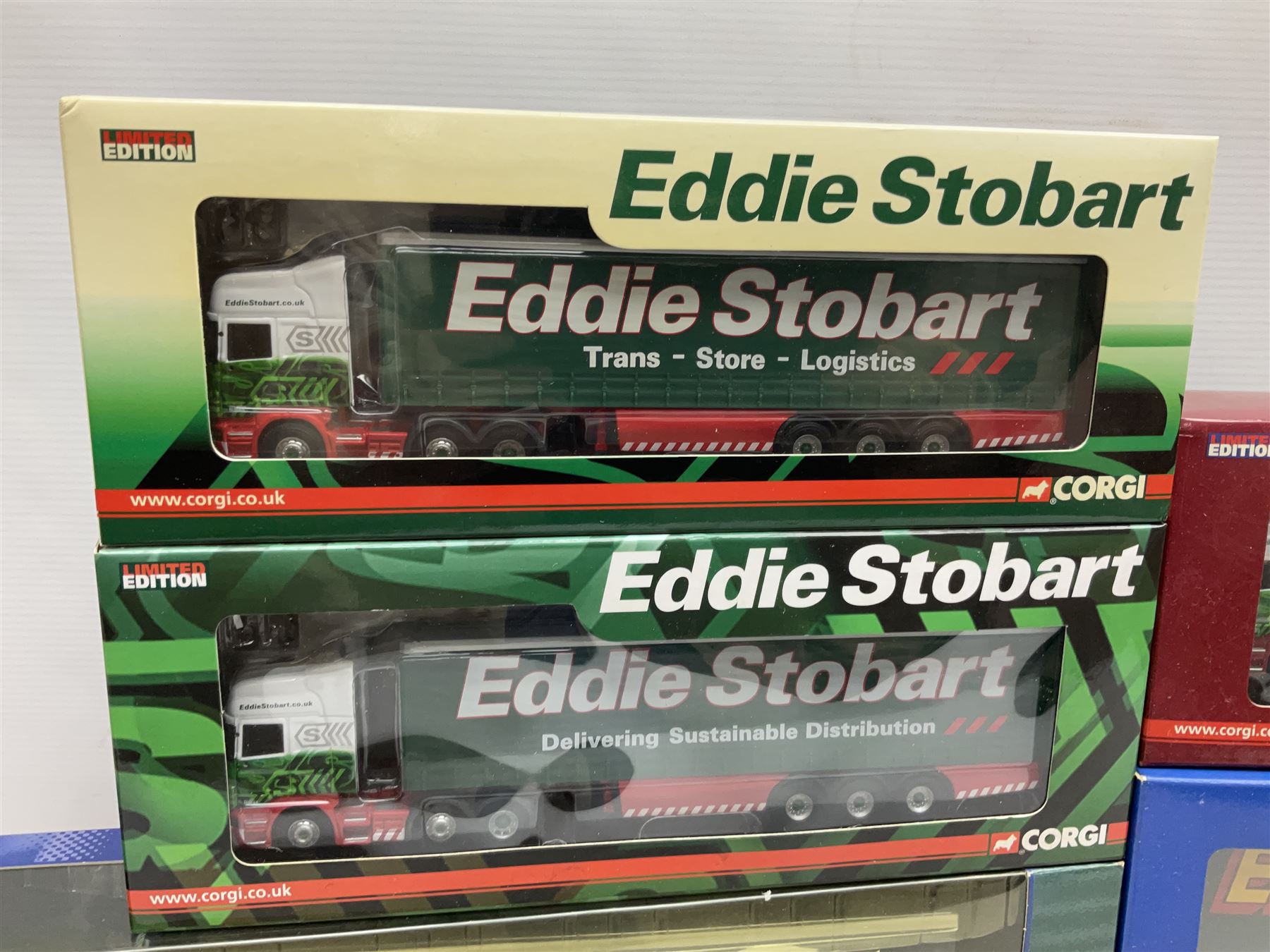 Corgi Eddie Stobart - Hauliers of Renown CC19904 Curtainside Trailer; two limited edition Scania R Curtainside CP18110 & CP18111; Roadscene CC18106 Scania R Curtainside; and three customer livery lorries CC86603  Sunpride, CC86604 Knauf and CC86702 The Mirror; all boxed (7)