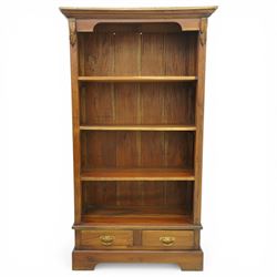 Late 20th century Georgian design hardwood open bookcase, moulded cornice above a shaped f...