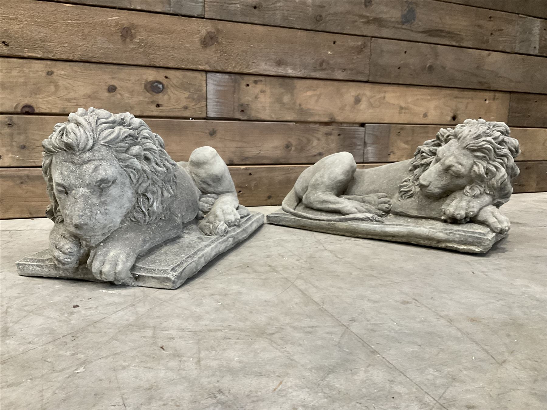 Pair of small recumbent garden lions