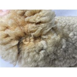 1950s sheepskin plush covered teddy bear with musical movement, the revolving head with applied eyes, leather nose and stitched mouth, jointed limbs with leather pads H50cm