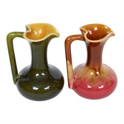 Christopher Dresser for Linthorpe Pottery, two of miniature jugs in red and green, shape number 850, with impressed mark beneath, H9cm