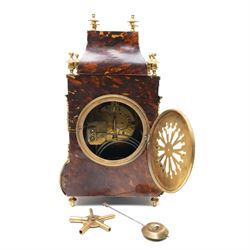 French-late 19th century brown stained 8-day faux Tortoise shell and ormolu mounted mantle clock, rectangular case with glazed side panels and shaped pediment with matching finials, convex enamel dial with Roman numerals, minute track and steel moon hands within a cast brass glazed dial bezel,
twin barrel movement with rack striking, striking the hours and half hour on a coiled gong. With pendulum and key.
