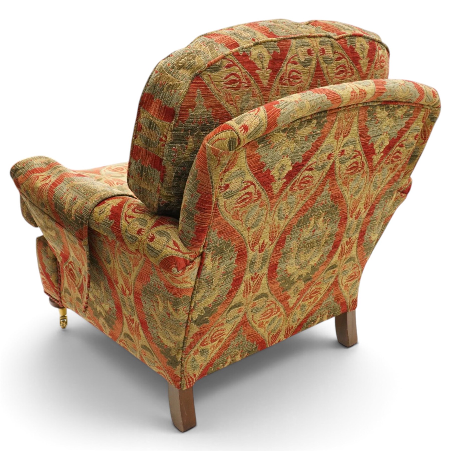 Duresta - traditional shape armchair with out-swept arms, upholstered in crimson ground fabric decorated with palmettes and foliate motifs with matching loose and scatter cushions, raised on compressed bun feet with brass cups and castors