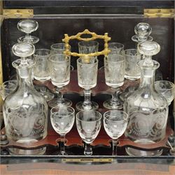 19th century French Boulle-style cave à liqueur or travelling decanter set, with musical mechanism playing carrara bonne de ay and Locked in the old Kent Road, the walnut box of serpentine front, the hinged lid with central brass and mother of pearl cartouche, with removable wooden tiered tray with gilt metal handle, containing four foliate etched glass decanters and sixteen glasses, H27cm