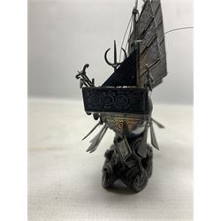 Chinese miniature silver model of a junk ship, with textured sails, mounted upon a carved wooden stand, H14cm
