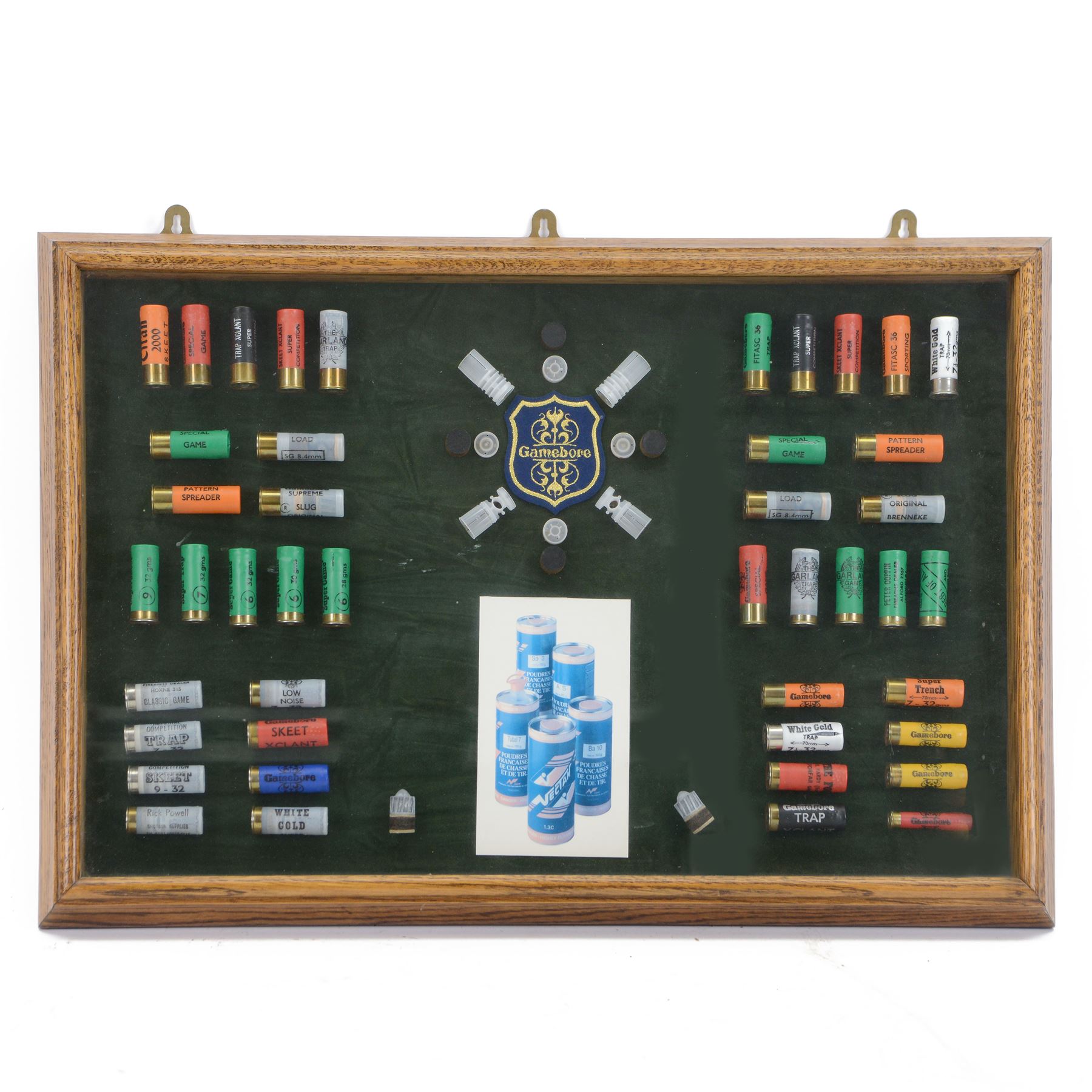 SHOTGUN LICENCE REQUIRED Gamebore shotgun cartridge advertising display board with green background in a glazed oak case, H51cm