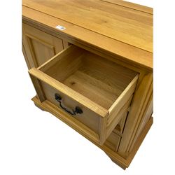Light oak side cabinet, fitted with single cupboard and three drawers