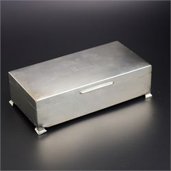 Engine turned silver rectangular cigarette box on bracket feet W18cm London 1964 Maker Garrard & Co
