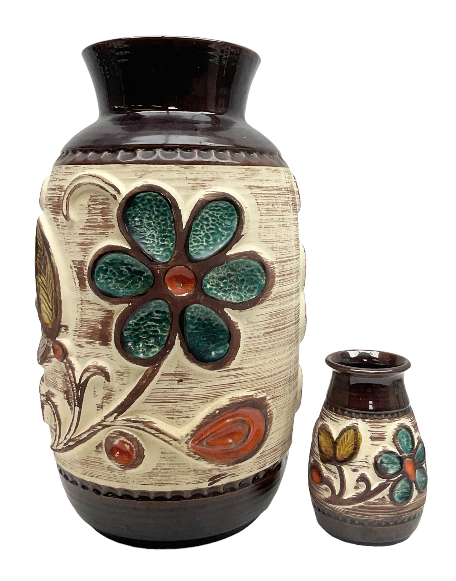 Pair of Bay West German vases, with bold moulded flower and foliage decoration in green, orange and ochre on brown ground, largest H40cm