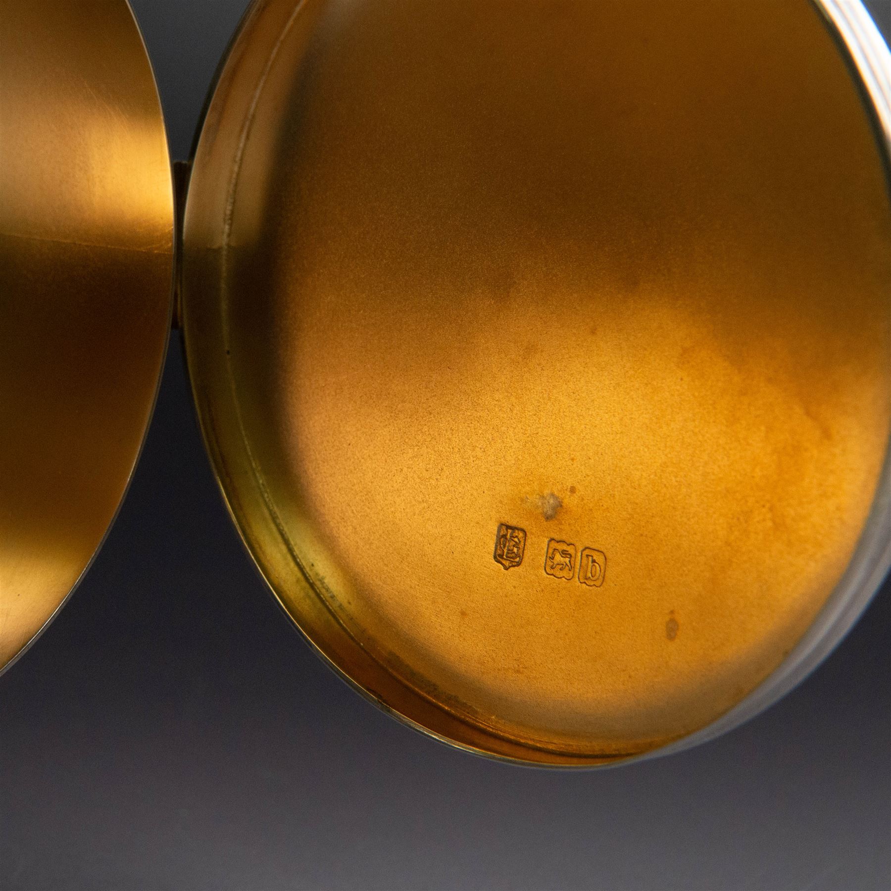 Late Victorian silver lunette, of plain circular form with hinged cover opening to reveal gilt interior, upon a circular domed foot, hallmarked Lambert & Co, London 1897, H13cm