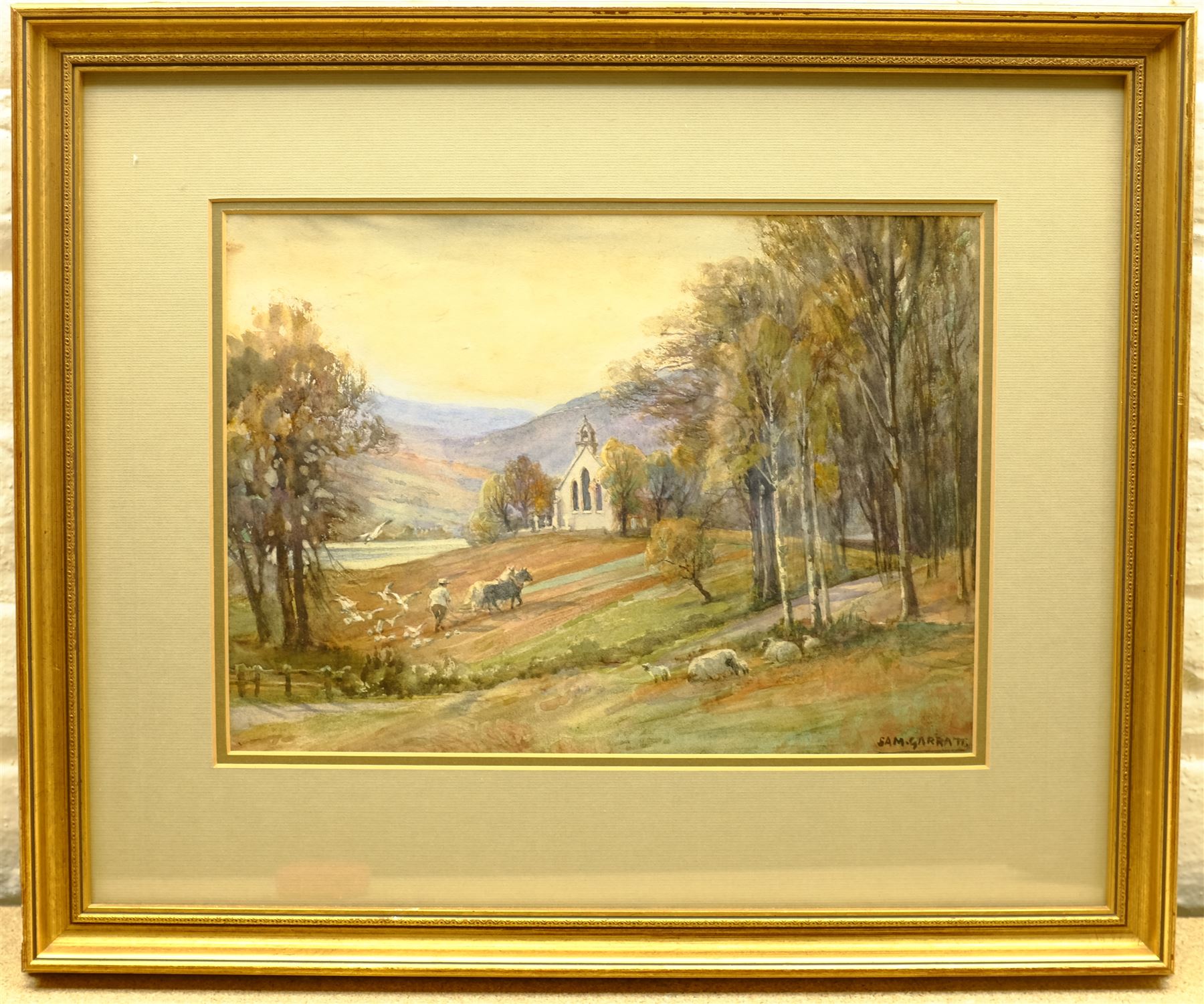 Sam Garratt (British 1864-1946): Ploughing Beside a Church, watercolour signed 26cm x 36cm