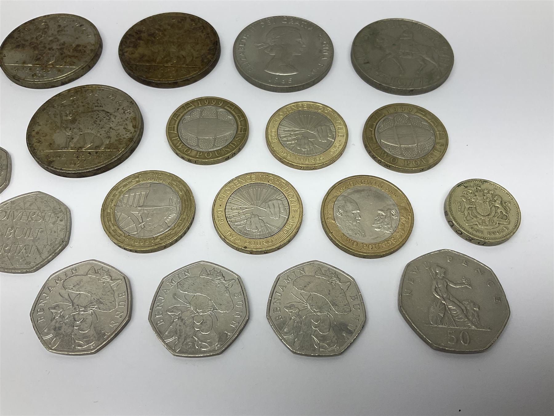 Queen Elizabeth II commemorative coins, including three Isle of Man 1970 crown coins, two further UK 1965 and 1970 crowns, three 2017 ‘Benjamin Bunny’ fifty pence pieces, two 1999 ‘Rugby World Cup’ two pound coins, Isle of Man 1999 ‘Phillip McCallen’ fifty pence piece etc