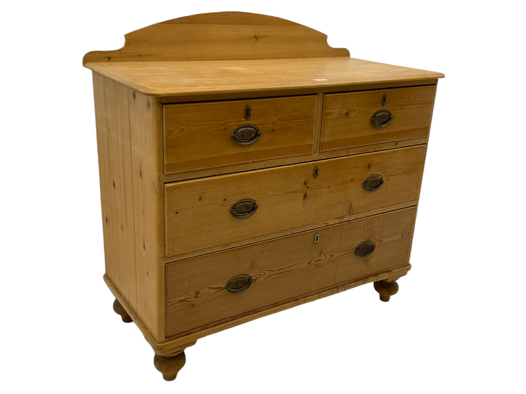 Victorian pine chest, raised shaped back, fitted with two short and two long drawers, on turned feet