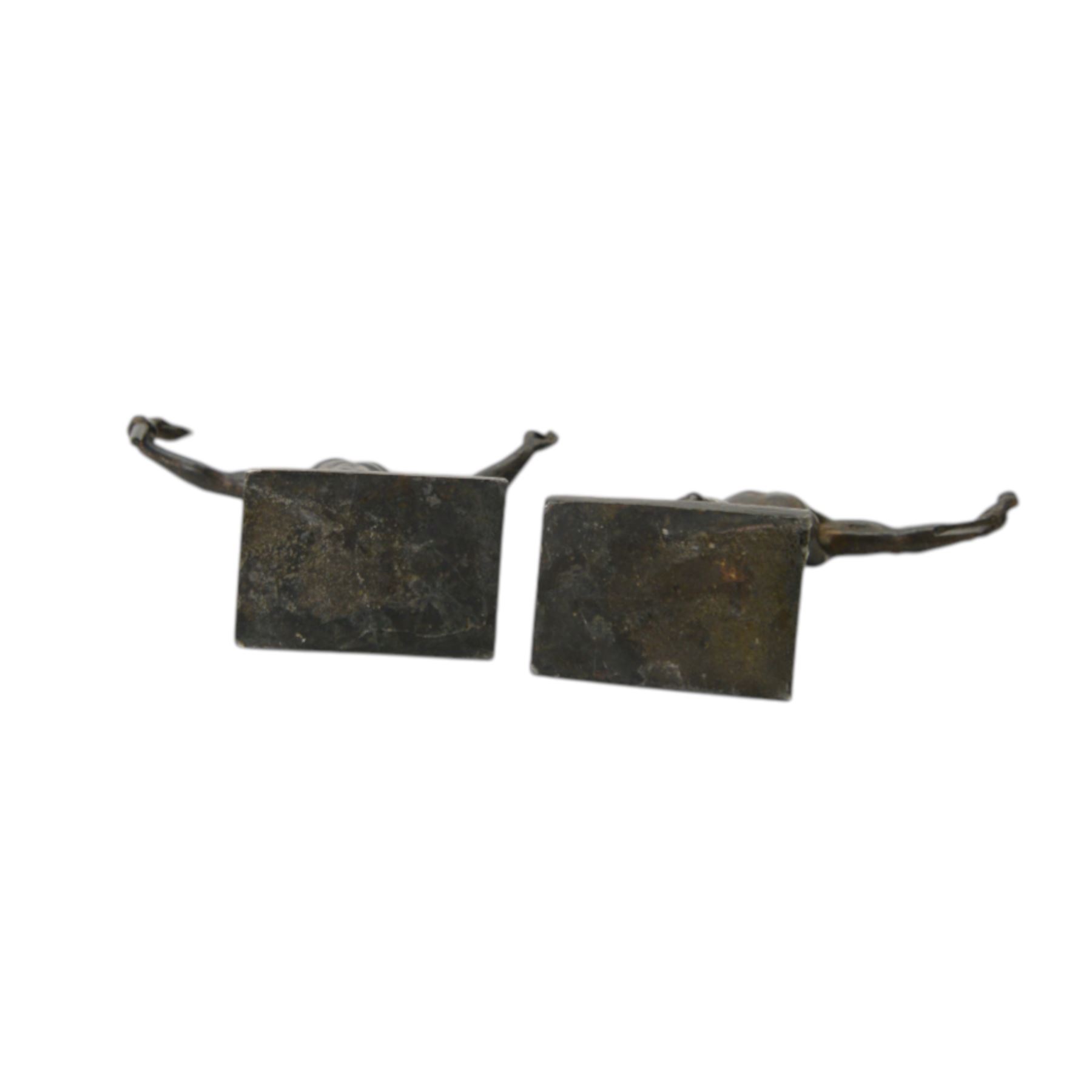Composite cast bust of Hitler, together Third Reich Nazi German style desk stand depicting the national eagle and swastika on a black stone base, together with two other figures, bust H17cm 