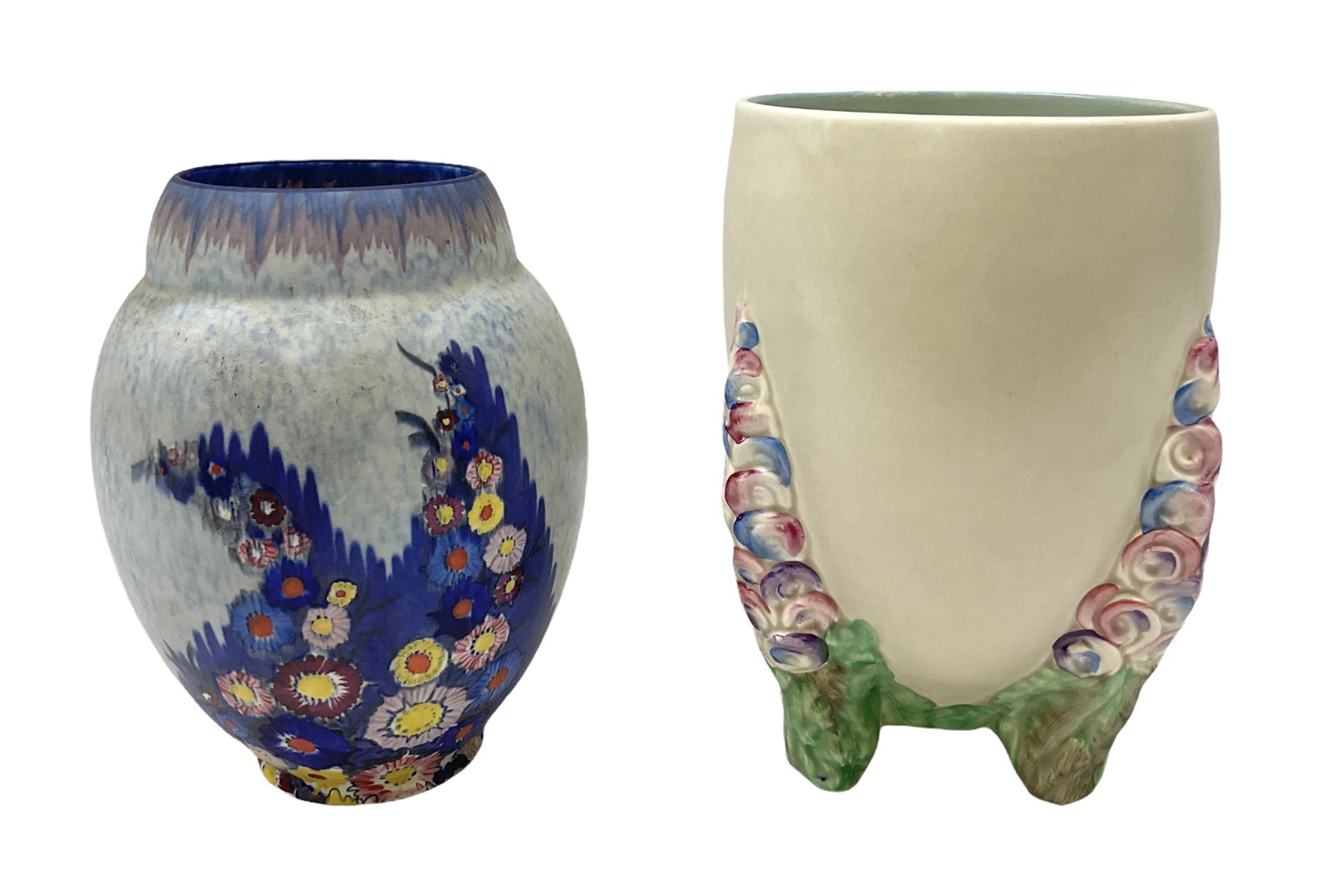 1930s Carlton Ware Art Deco Garden pattern vase of shouldered ovoid form, decorated with blue, pink and yellow flower heads on a mottled blue and white ground, pattern no. 3413, with printed and painted marks beneath, H19cm, together with a Clarice Cliff My Garden pattern vase, raised upon three feet with blue, pink and purple moulded Hollyhock design, H20cm, with Clarice Cliff Wilkinson Ltd England marks beneath