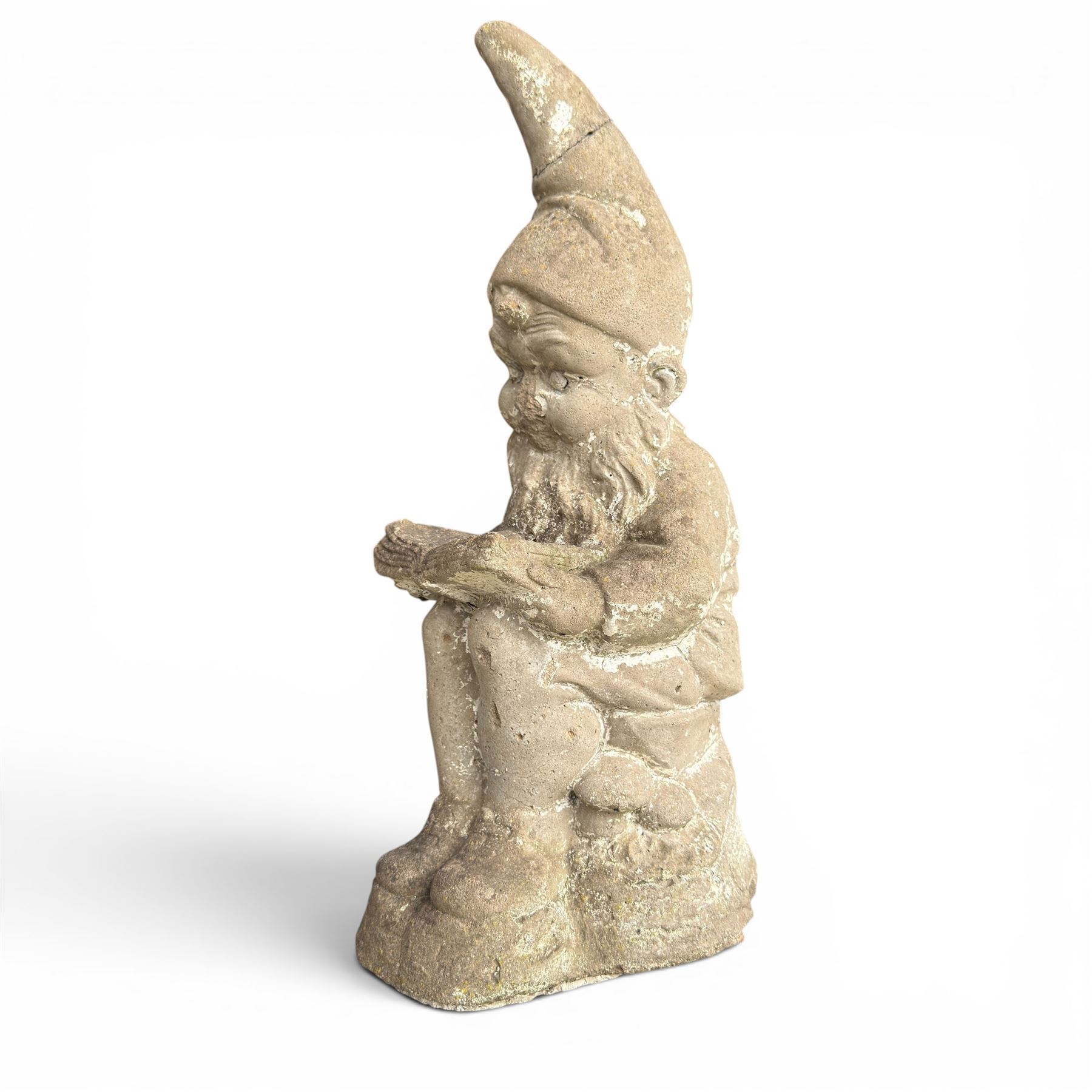 Two seated cast stone garden gnomes