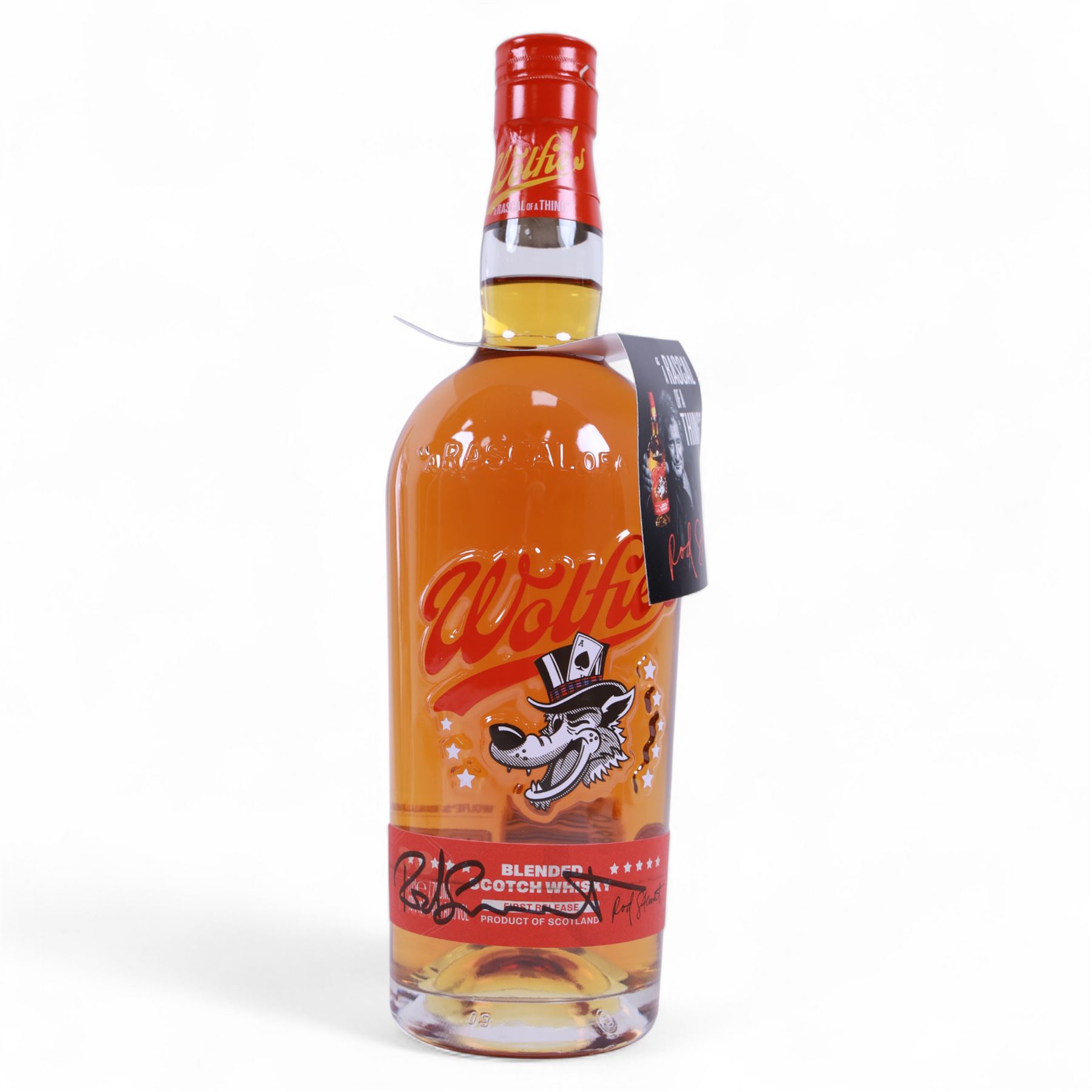 Signed bottle of Rod Stewart edition Wolfie's blended scotch whisky, together with Rod Stewart memorabilia, including first edition of his autobiography, colour photograph and two 7 inch singles