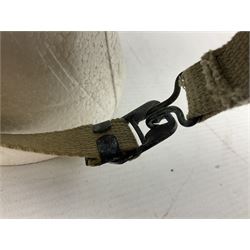 American first type paratrooper helmet with post-WW2 strap and D-rings and later 1944 liner bearing Firestone Tyre and Rubber Company mark; green textured finish