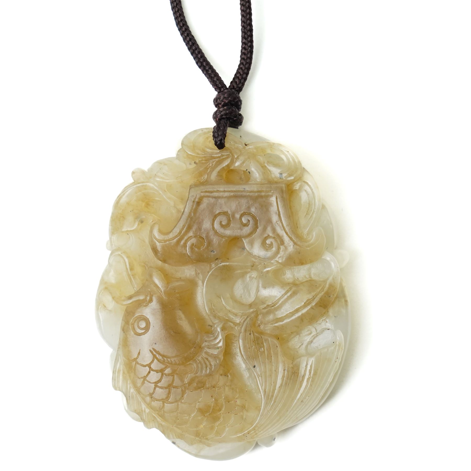 Set of three Chinese carved green hard stone pieces, depicting dragons and clouds, largest W5cm 