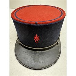 Three French Foreign Legion Kepis; two infantry examples and the third Calvary, each with black peak, original leather sweatband and markers mark stamped inside 