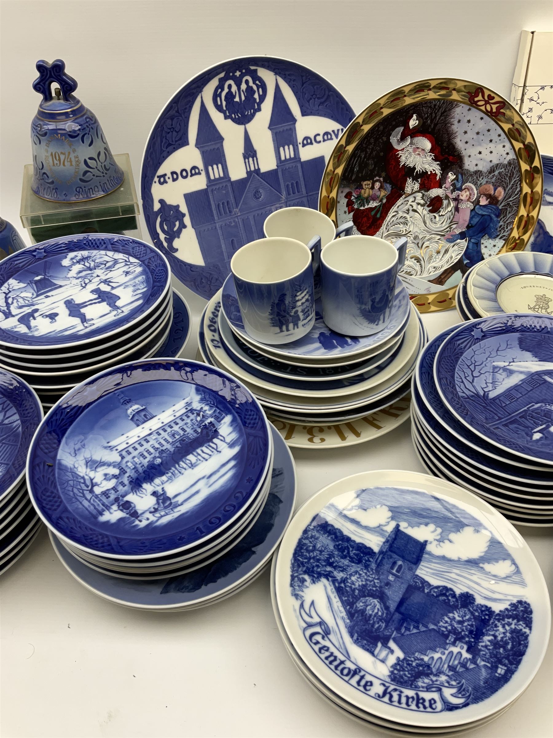 Royal Copenhagen thirty-eight assorted Christmas calendar plates, from 1963 to 1992, a selection of other Royal Copenhagen decorative plates, a collection of Bing and Grondahl plates, ceramic bells, etc. 