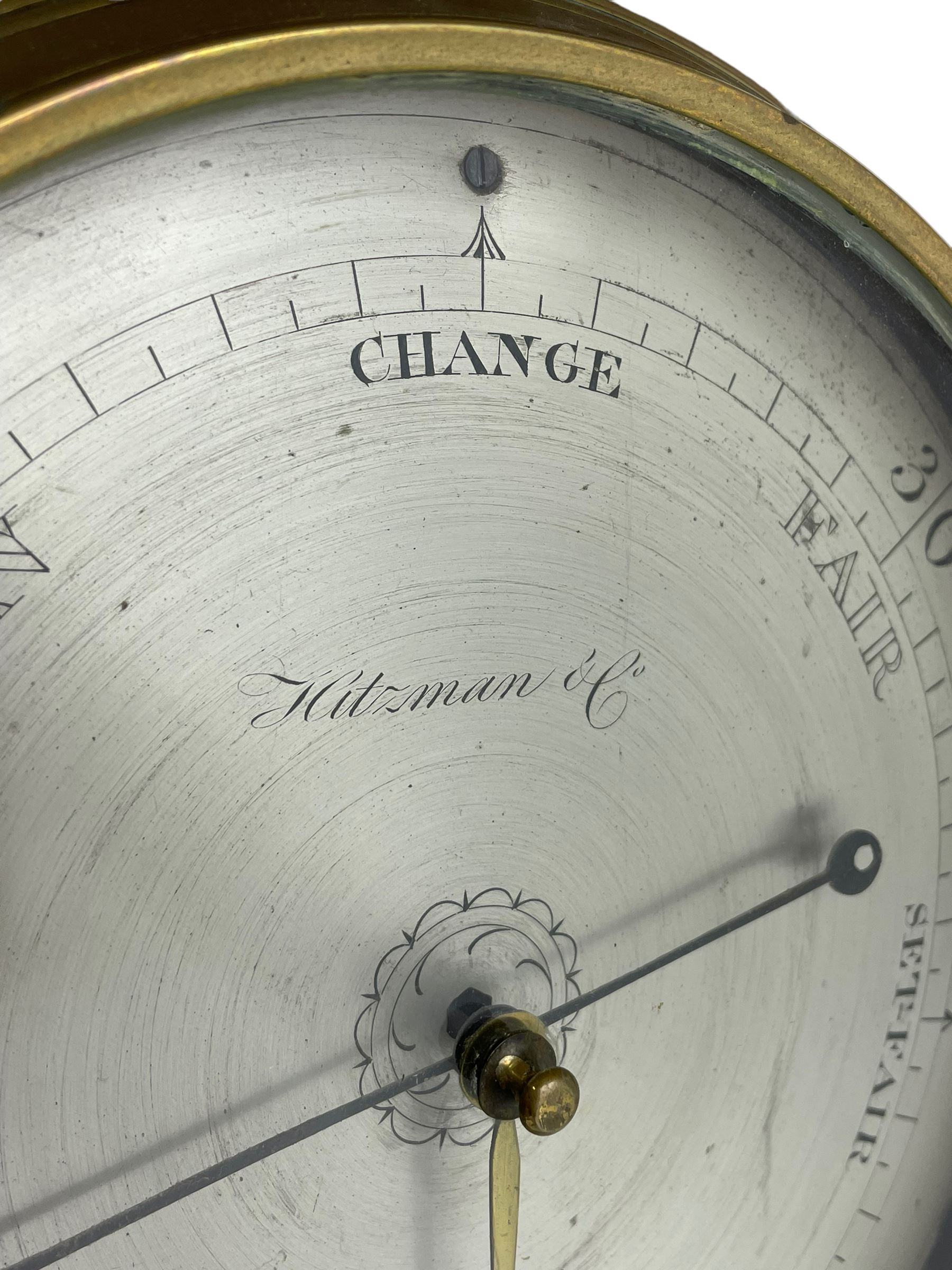 Hitzman & Co of Cambridge - Early 19th century mahogany mercury wheel barometer c1830,
With a broken pediment and finial, rounded base, and lined stringing to the edge, cast brass bezel with an 8-inch circular silvered register calibrated in inches and signed Hitzman & Co, Cambridge, with brass setting pointer to the glass, beneath an arched 12” Fahrenheit scale spirit thermometer with a silvered register. Joseph and Henry Heitzman were German barometer makers and clock importers who lived and worked in Trinity Street Cambridge 1820-1900, often found as here spelt Hitzman.
