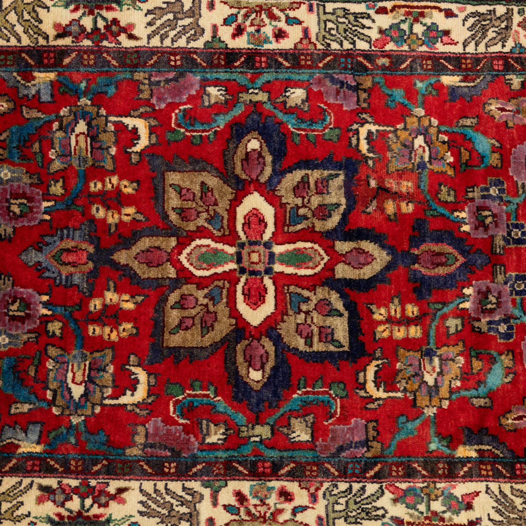 North West Persian Mahal hand-knotted runner, deep red ground, with a vertical arrangement of angular floral and geometric motifs, enclosed by an ivory border  of stylized leaves and rosettes, with guard stripes on indigo ground, cotton fringe ends 