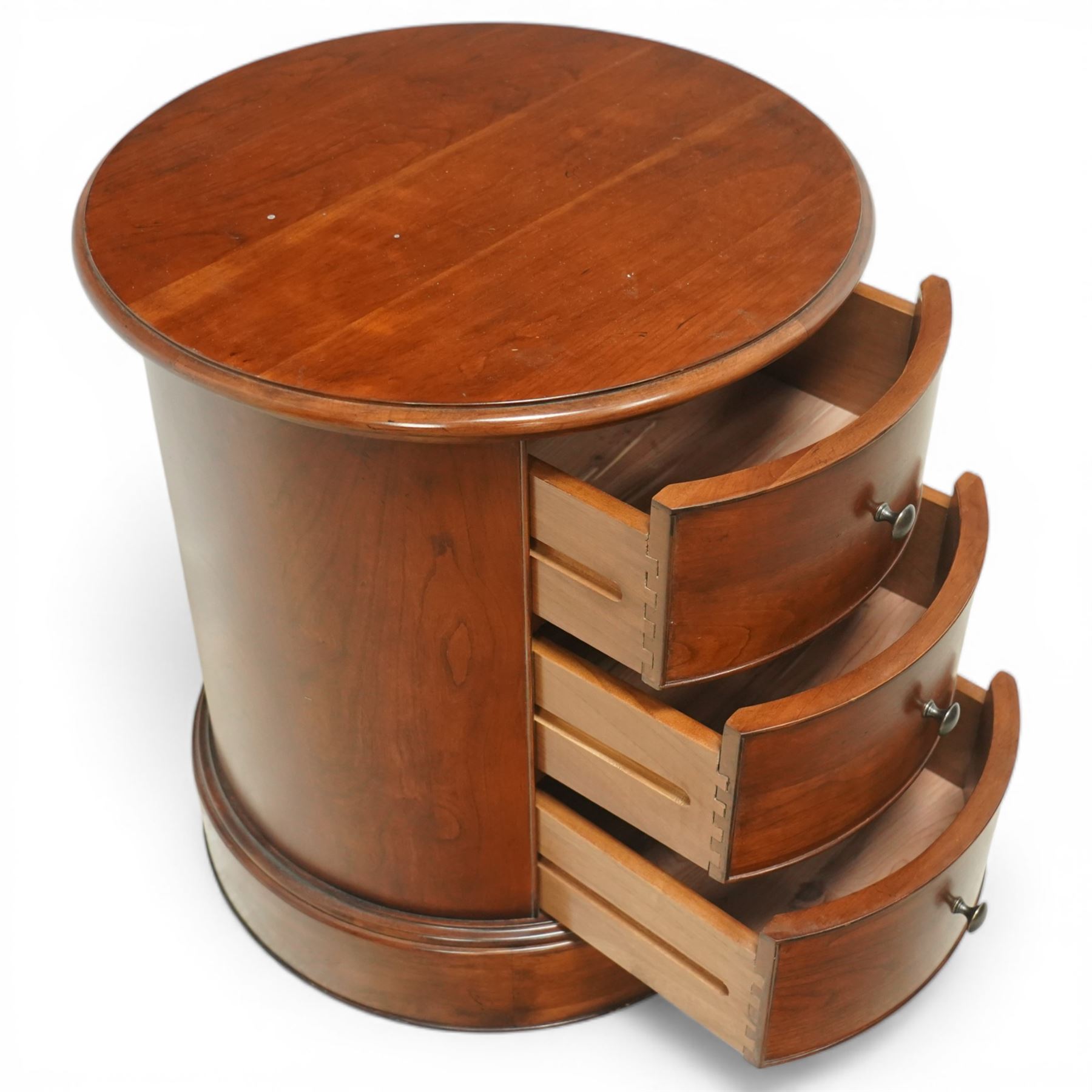 Willis & Gambier - circular chest, three drawers with brass pulls on a moulded 
