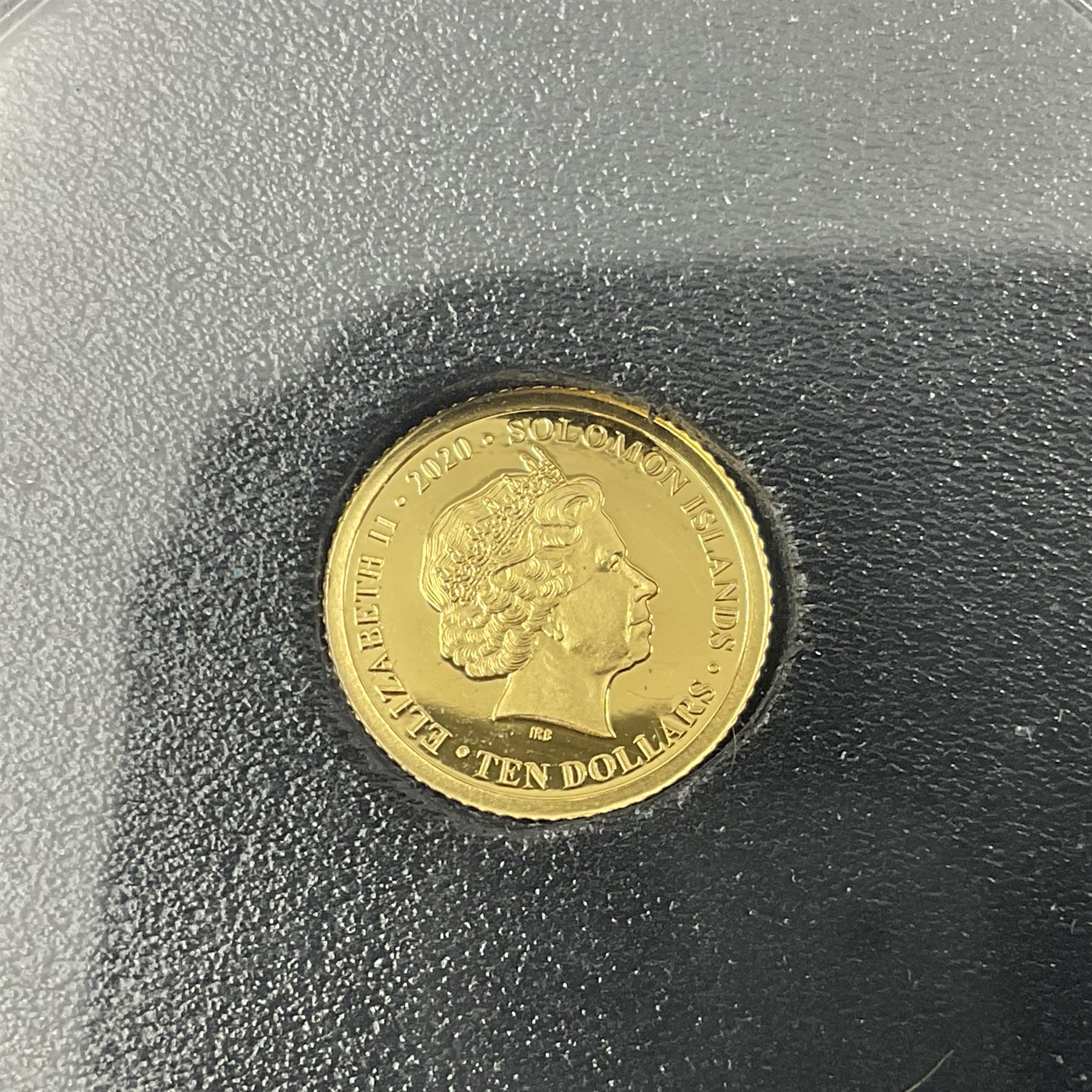 Eleven Queen Elizabeth II miniature gold coins, each being 0.5 grams of 24 carat gold, including Tristan da Cunha 2020 'Laurel', Solomon Islands 2020 '80th Anniversary of the Battle of Britain' etc, all with certificates