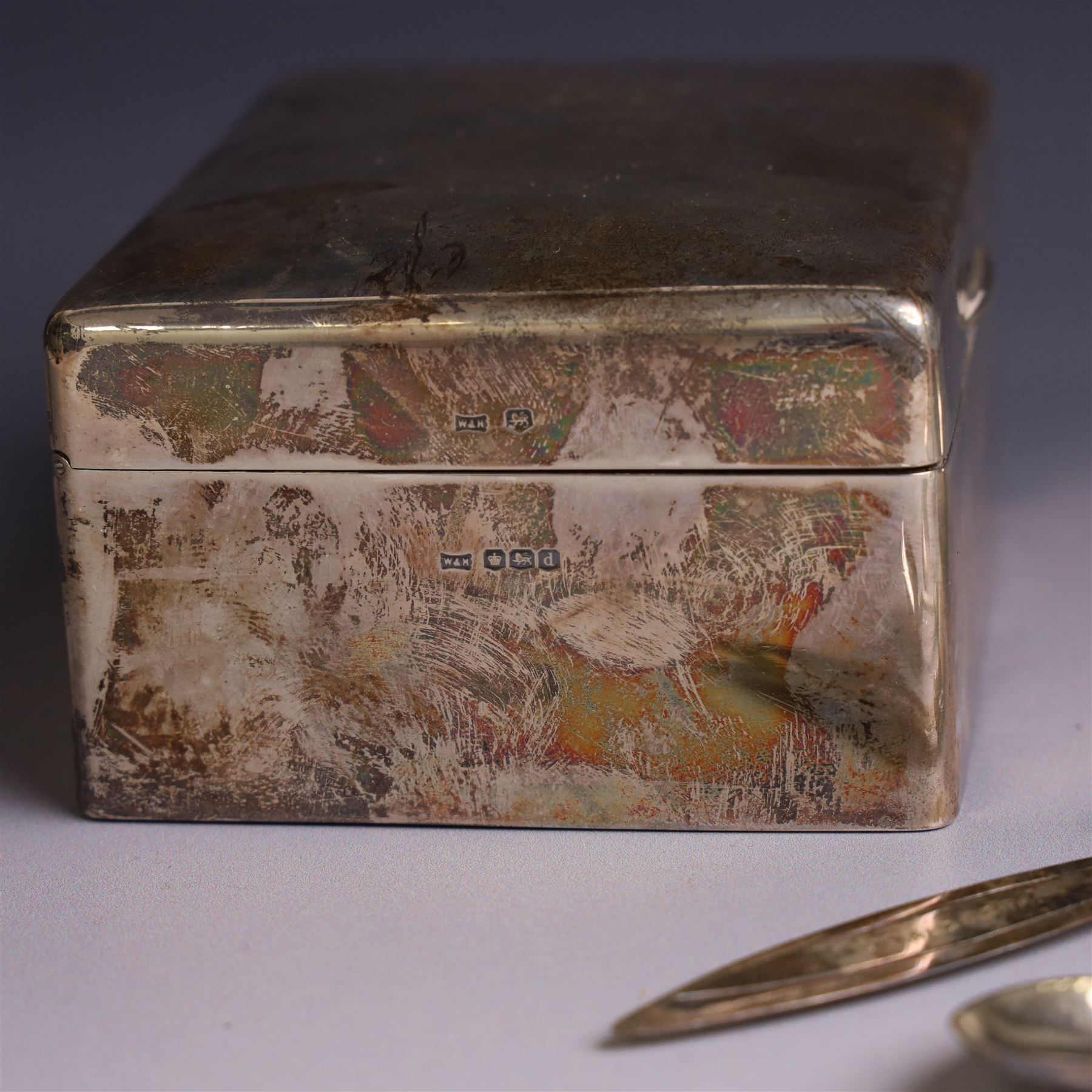 Group of silver, comprising silver mounted cigarette box, five decanter labels, page turner, commemorative teaspoon and a commemorative pin dish set with coin, all hallmarked