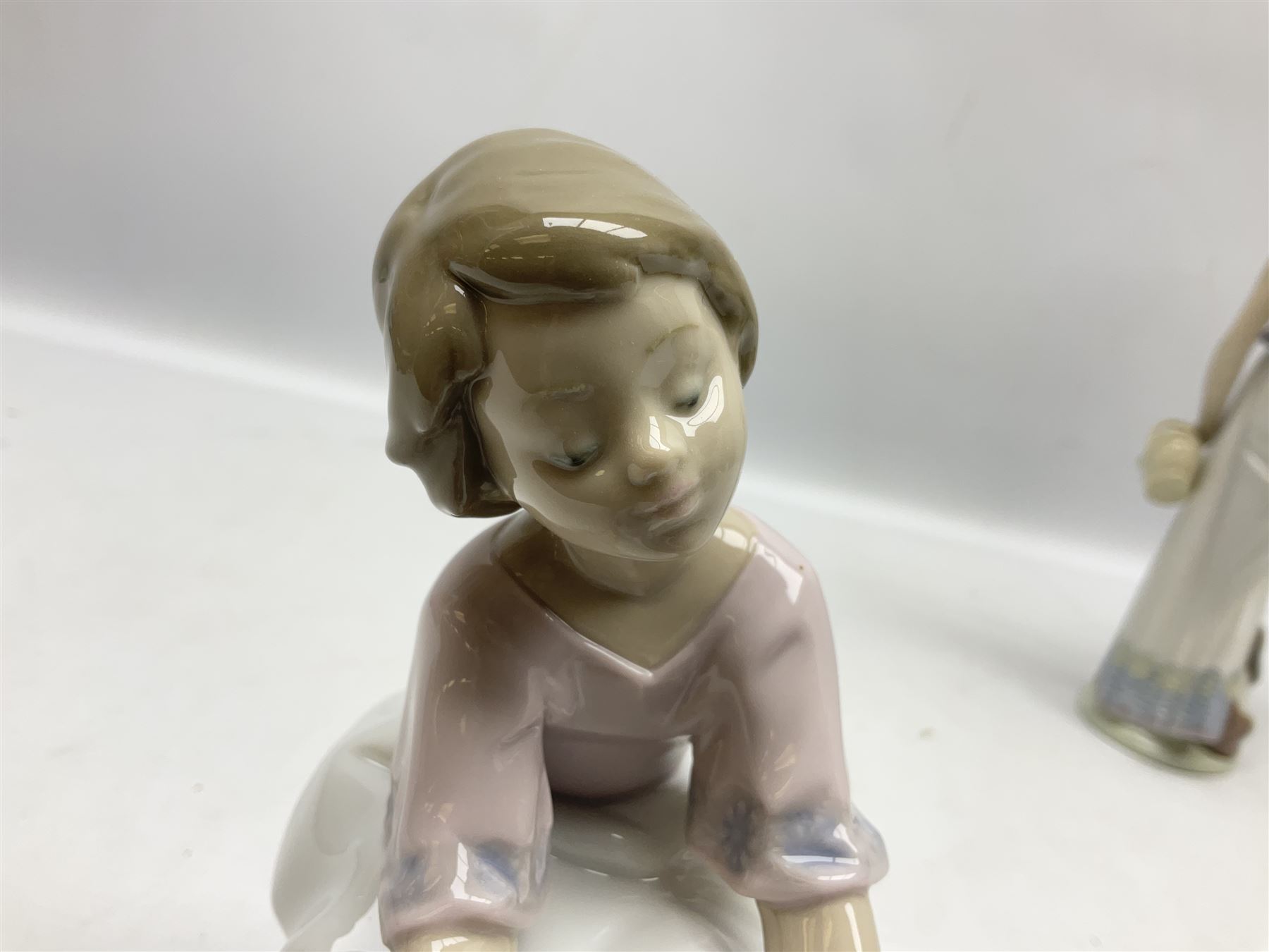 Three Lladro figures, comprising Garden Classic, signed no 7617, Summer Stroll no 7611 and Best Friend no 7620, all with original boxes, largest example H24cm 