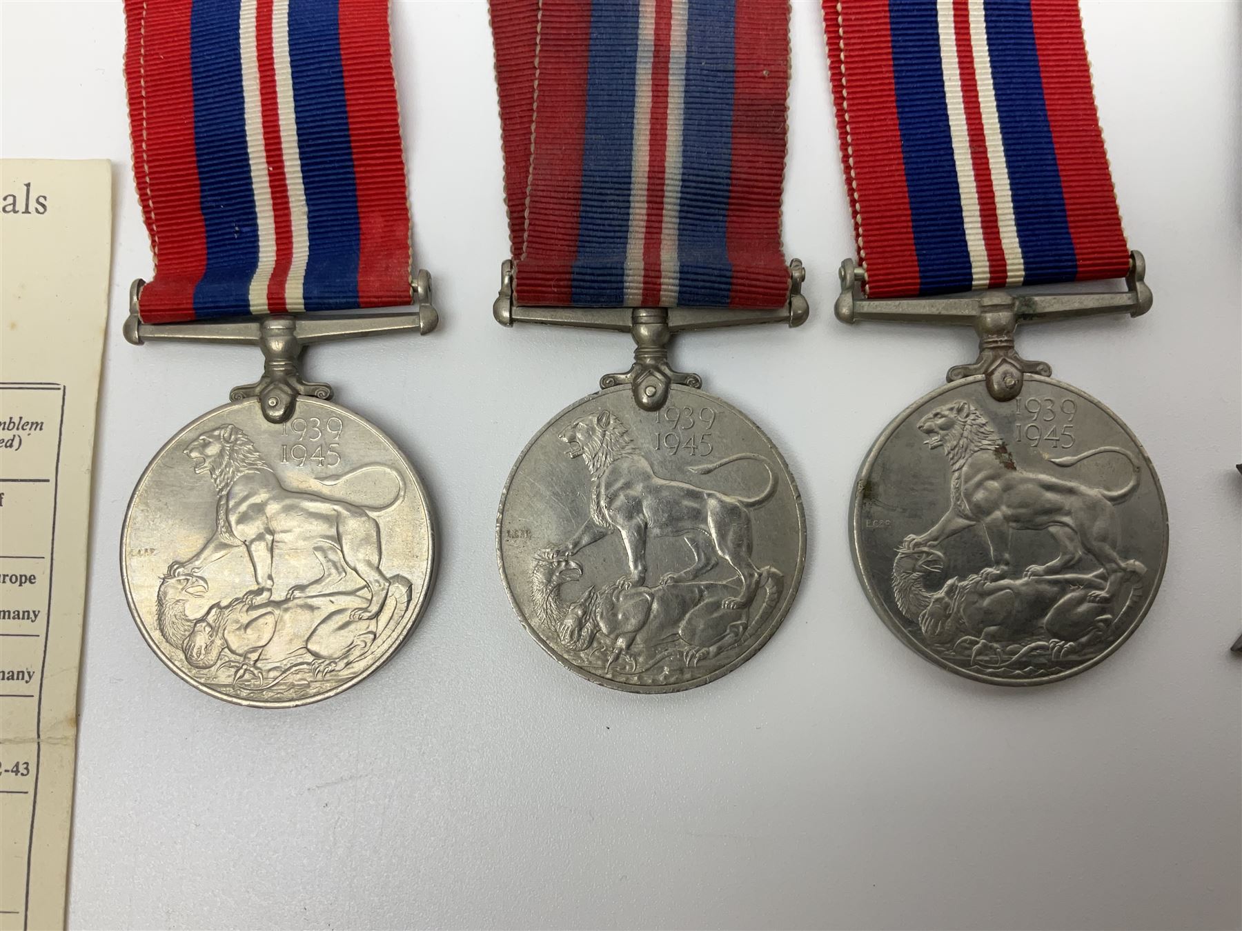 Eleven WW2 medals comprising three 1939-1945 war medals, two Defence medals, three 1939-1945 Stars, Atlantic Star, Africa Star and Italy Star; miniature QEII Naval LS & GC medal; all with ribbons; and WW2 postumous medal slip to Flight Sergeant L.N. Clark