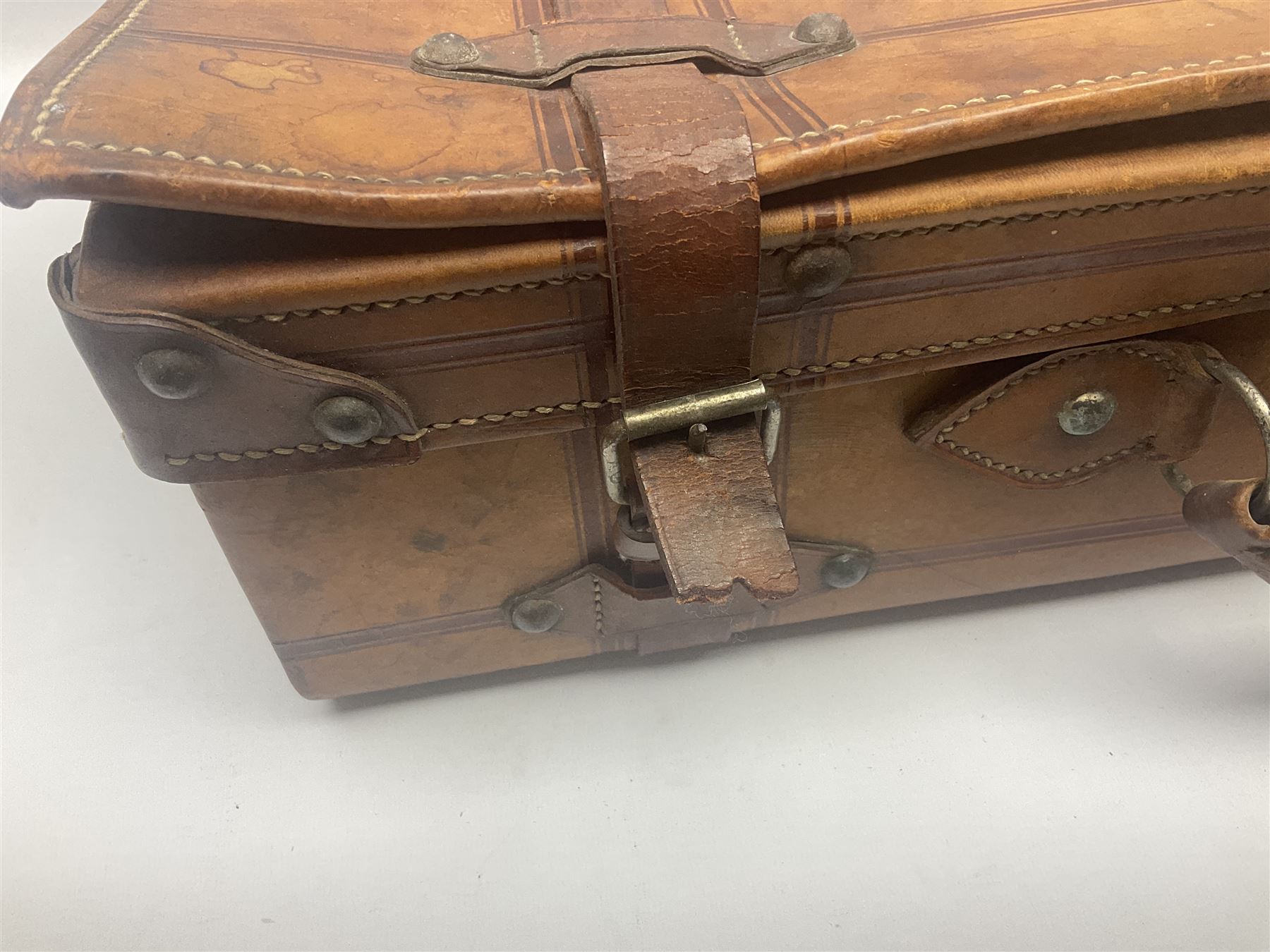 Late 19th/early 20th century stitched and studded leather portmanteau type suitcase with expanding lid and straps, L61cm