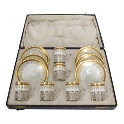 Boxed set of six Aynsley coffee cans and saucers, decorated with gilt greek key border, th...