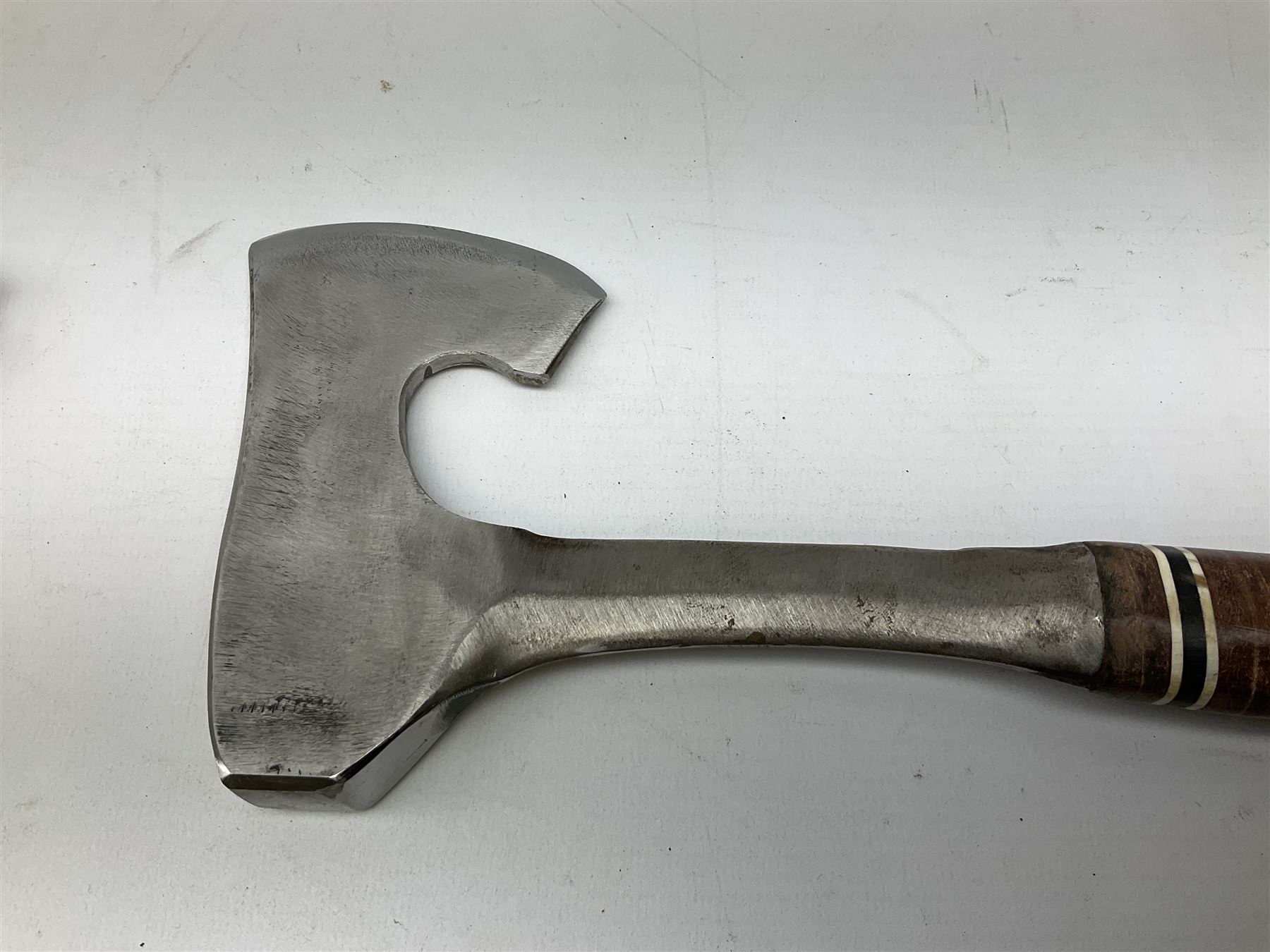 Estwing Black Eagle style double bit throwing axe with leather grip, virtually mint with labels present, plastic blade protectors and nylon sheath L43cm; another smaller Estwing axe stamped 24A to the pommel, with leather grip and sheath; and a vintage short handled hedge knife, the blade stamped IH (?) No.2 (3)