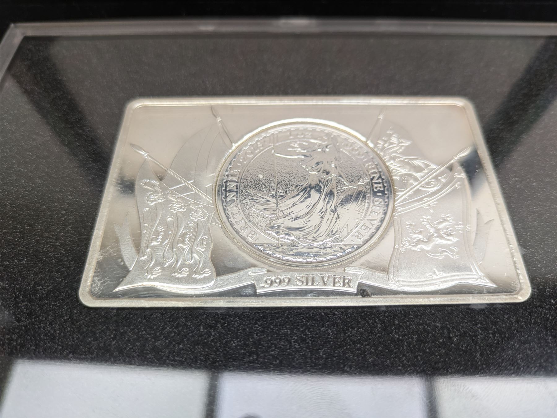 Baird and Co five ounce fine silver bullion 'Britannia Coin Bar', formed from a one ounce United Kingdom one ounce silver Britannia coin set into a four ounce bar, cased with Westminster certificate, together with various Queen Elizabeth II commemorative coins or medallions in card folders