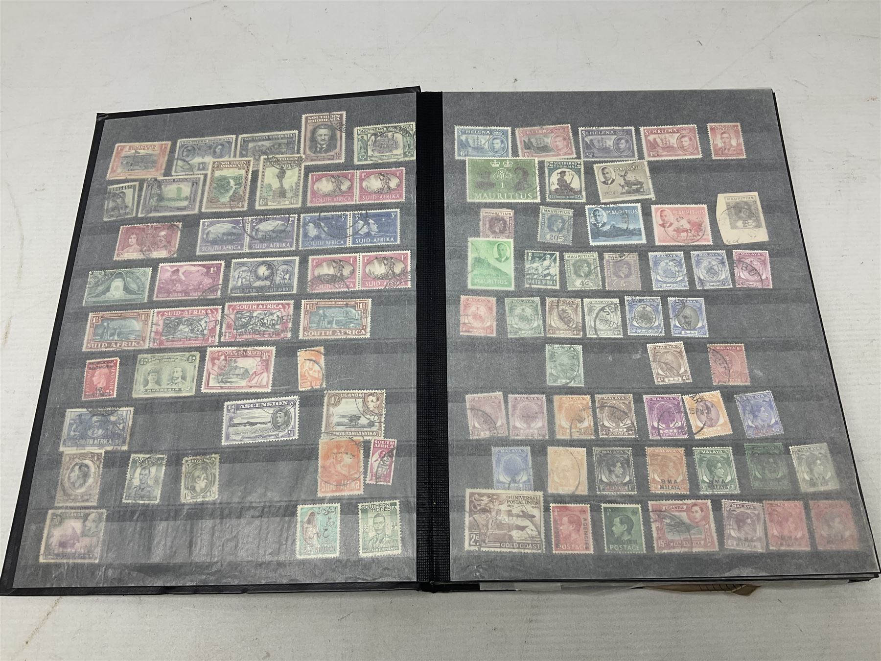 Stamps including St Helena, Fiji, Southern Rhodesia, Malaya, Bermuda, Queen Victoria and later Ceylon, various Universal Postal Union 1949 etc, housed in six albums/folders