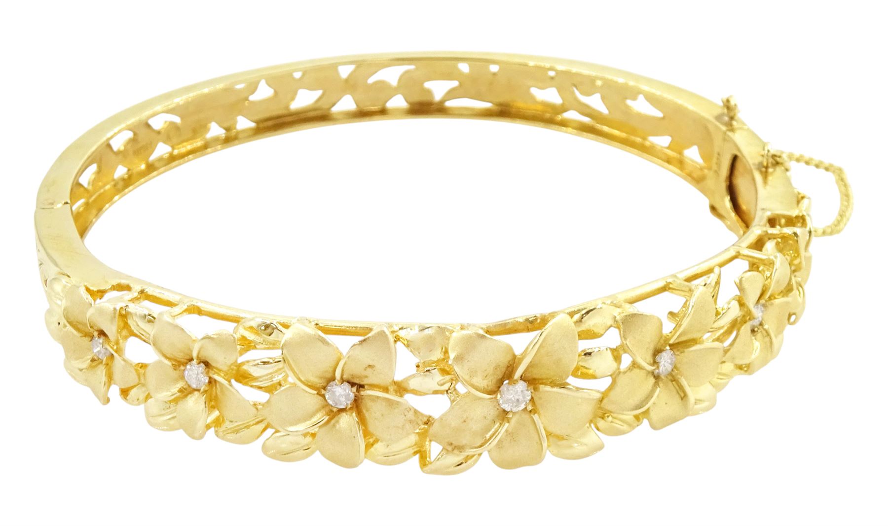 14ct gold diamond flower head hinged bangle, seven graduating flowers, each set with a single round brilliant cut diamond, to a pierced and engraved foliate body, stamped