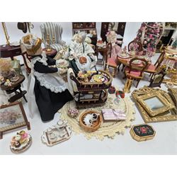 Dolls house living room and ding room furniture, including sofa, chair, long case clock, Christmas trees, fireplace, dresser, chairs, tables, mirrors, seven figures and a collection of predominantly Christmas themed decorations, food, etc