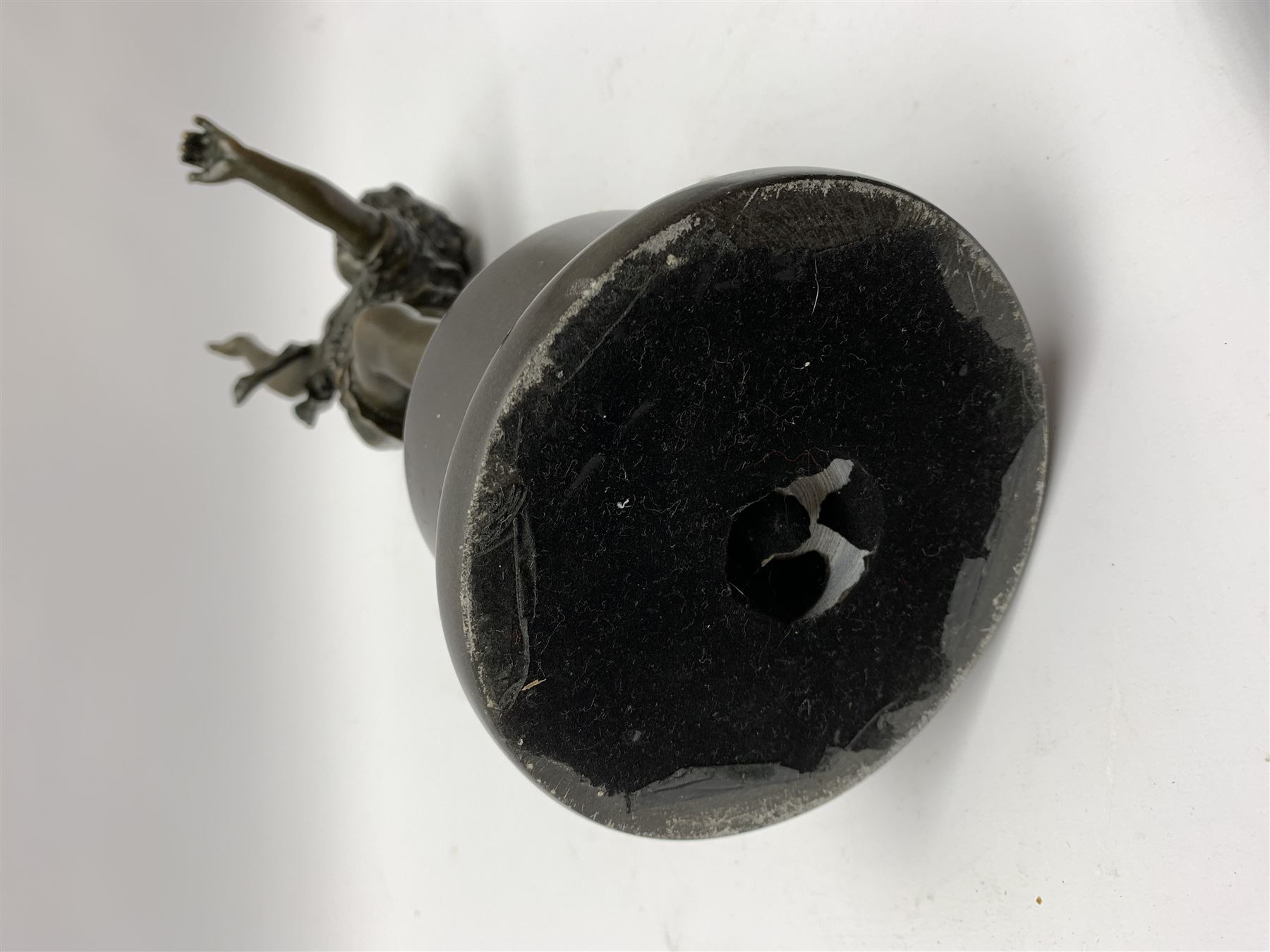 After E Plat, bronze modelled as a dancing child, signed E. Plat, upon cylindrical black marble base, H40cm