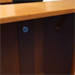 Light oak bookcase cabinet, fitted with four sliding tinted glass doors