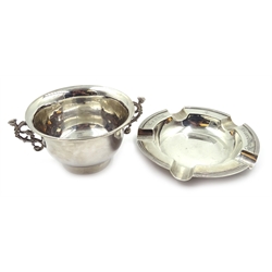 Silver twin handled bowl by Thomas Bradbury & Sons Ltd Sheffield 1902, 10cm and a silver ashtray by Walker & Hall Sheffield 1931, 13cm approx 7.2oz