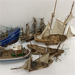 Six various wooden hulled model boats including sailing ships and fishing boats, various stages of condition and completeness, some requiring restoration, largest L82cm