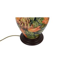 Moorcroft table lamp in Flame of the Forest pattern, of baluster form, on stepped wooden base, H35cm (excluding fitting)